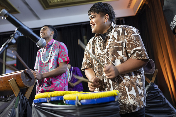 Pacific drummers on stage performing a drum roll